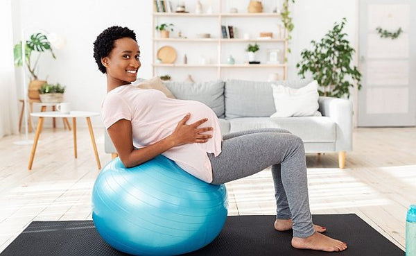 3. Pregnant lady exercising at home