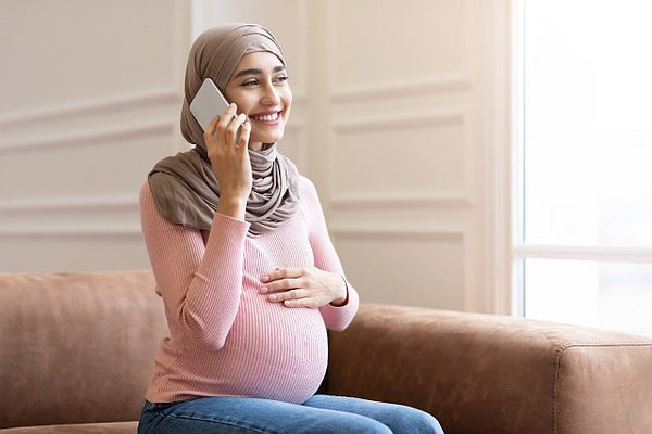 3. Pregnant woman on the phone