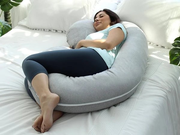 3. pregnant mum-to-be lying on a super comfy C shape pillow