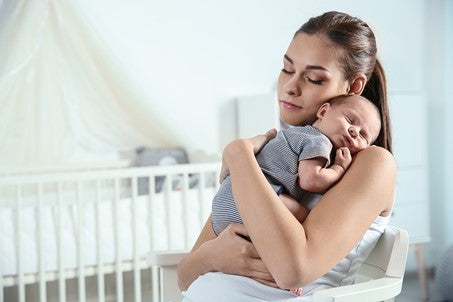 4. mummy holding a sleeping baby