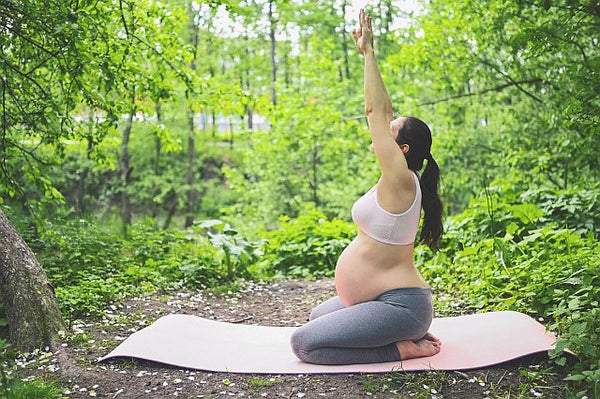 Pregnant exercise in the garden or local park