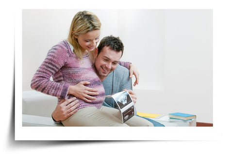 Couple Looking At Baby Scan - Stretch Mark Prevention