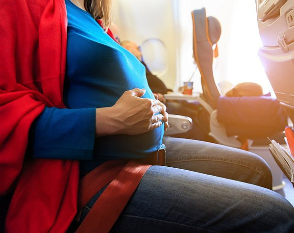 7. pregnant mum to be in aircraft cabin