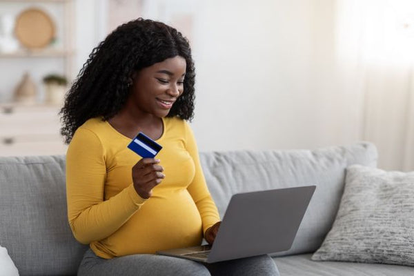 8. Pregnant mum-to-be getting things done on her laptop