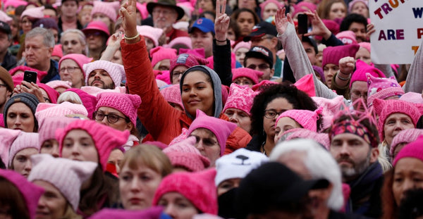 crowd wearing pink clothing