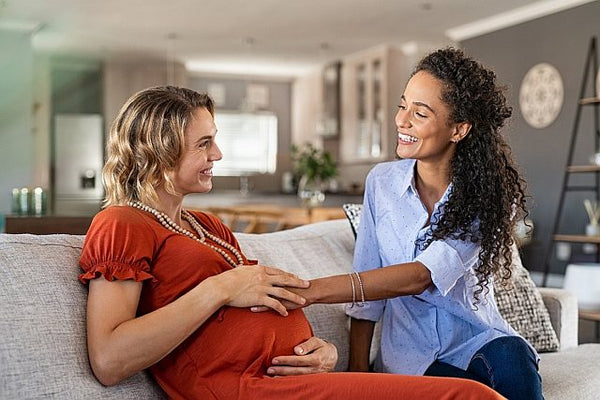 pregnant mum-to-be catching up with a friend