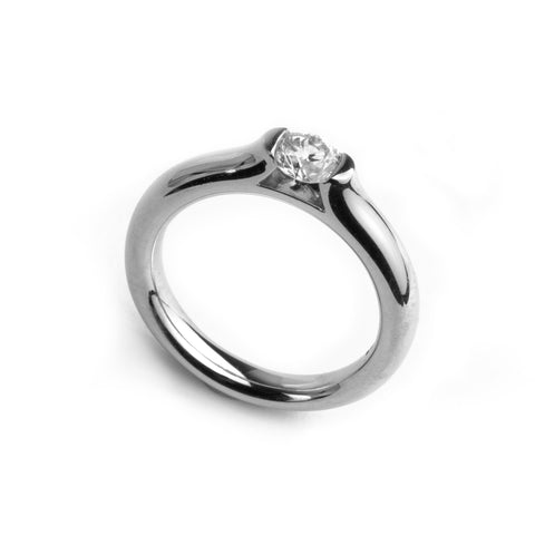 Platinum diamond engagement ring with a tension setting