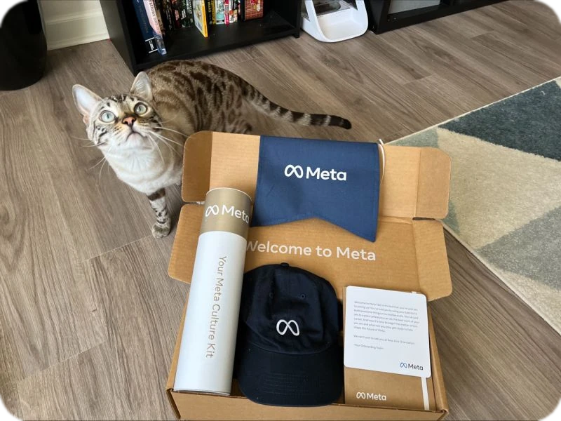 navy-blue cap, a branded pouch, and a cylindrical