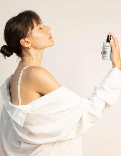 Women misting her face with Fount's Balancing Mist