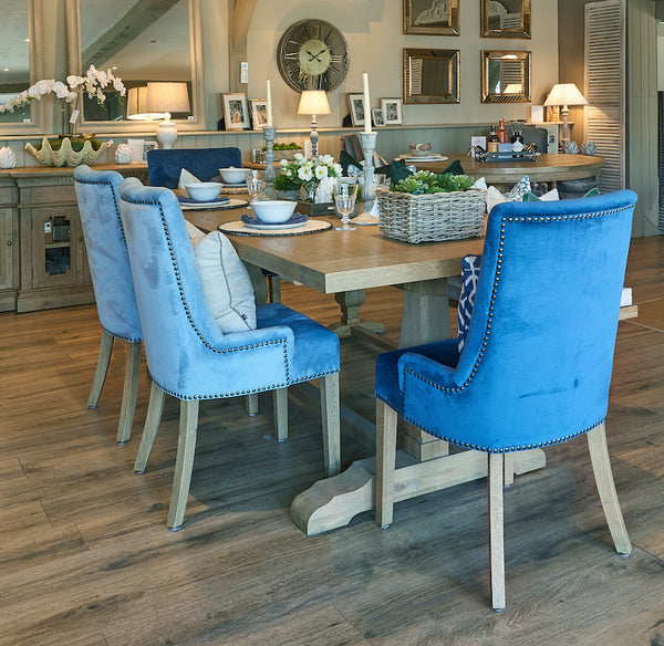 Belvedere weathered oak dining table and Hamilton velvet upholstered dining chairs in La Residence Interiors' showroom