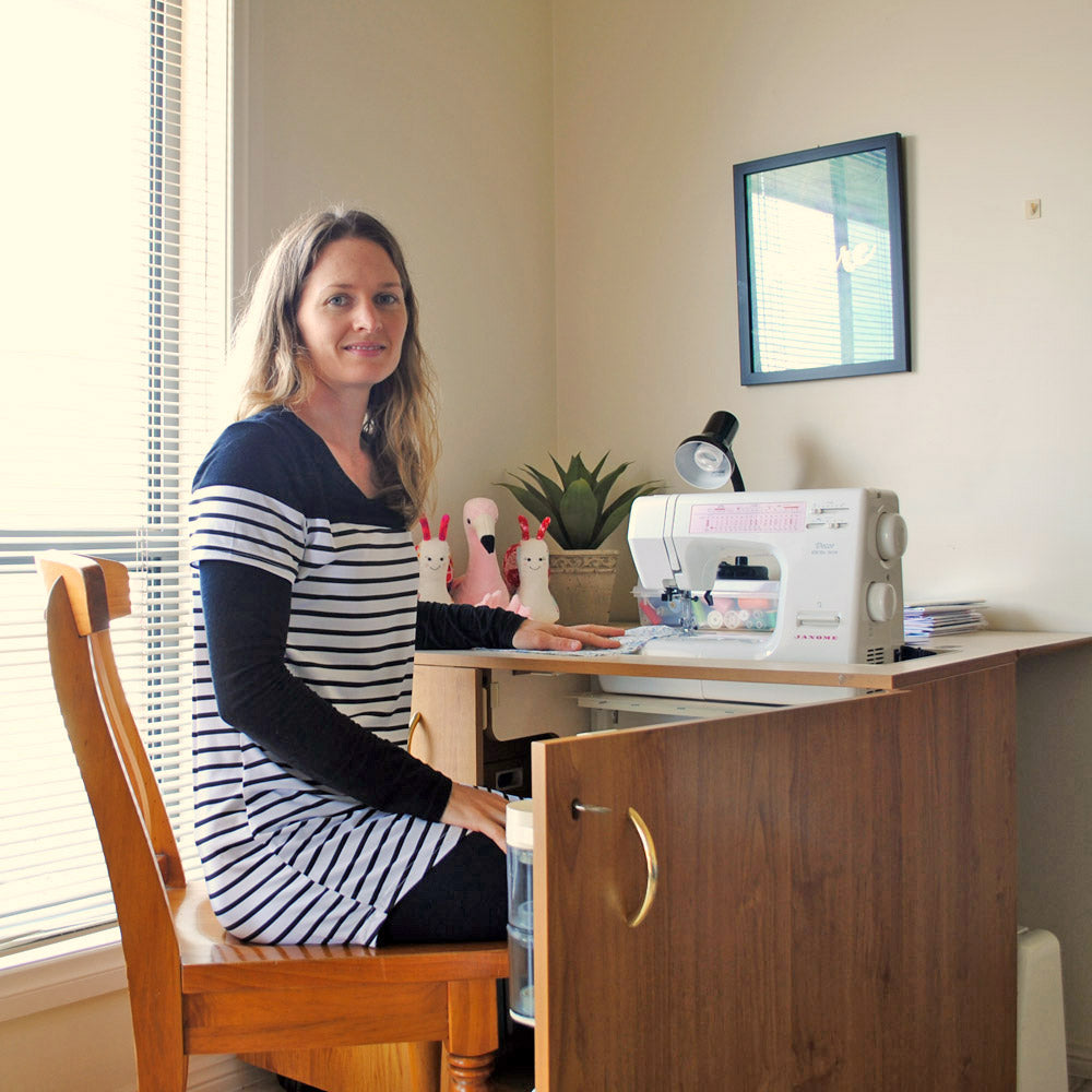 Anthea in her creative space in her living room