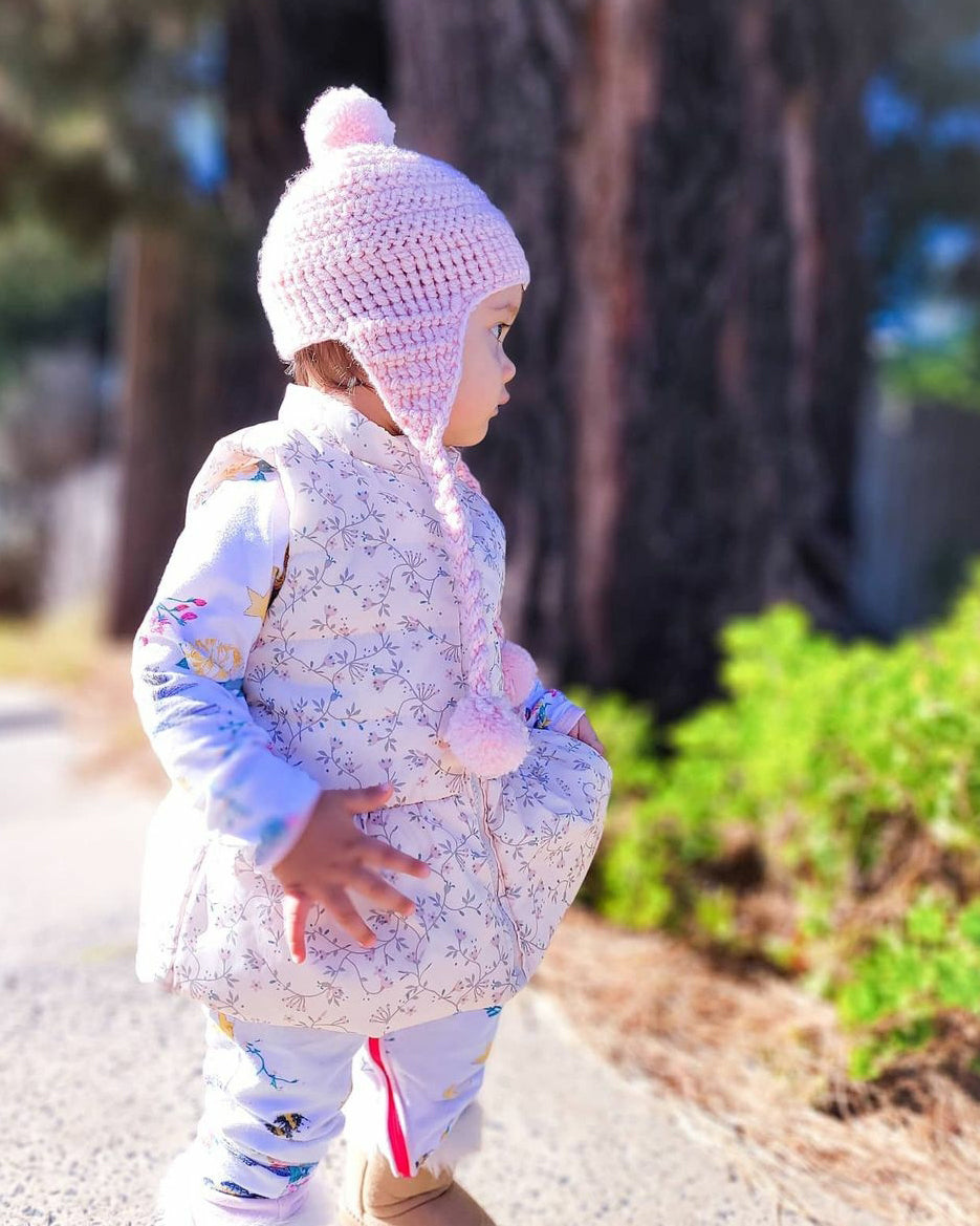 CherishÕs daughter Eli, rugged up for winter in a pink crochet beanie with ear flaps