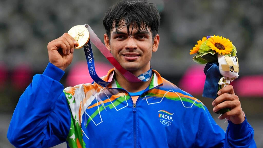 Neeraj Chopra holding gold medal in athletics at the Tokyo Olympics 2020