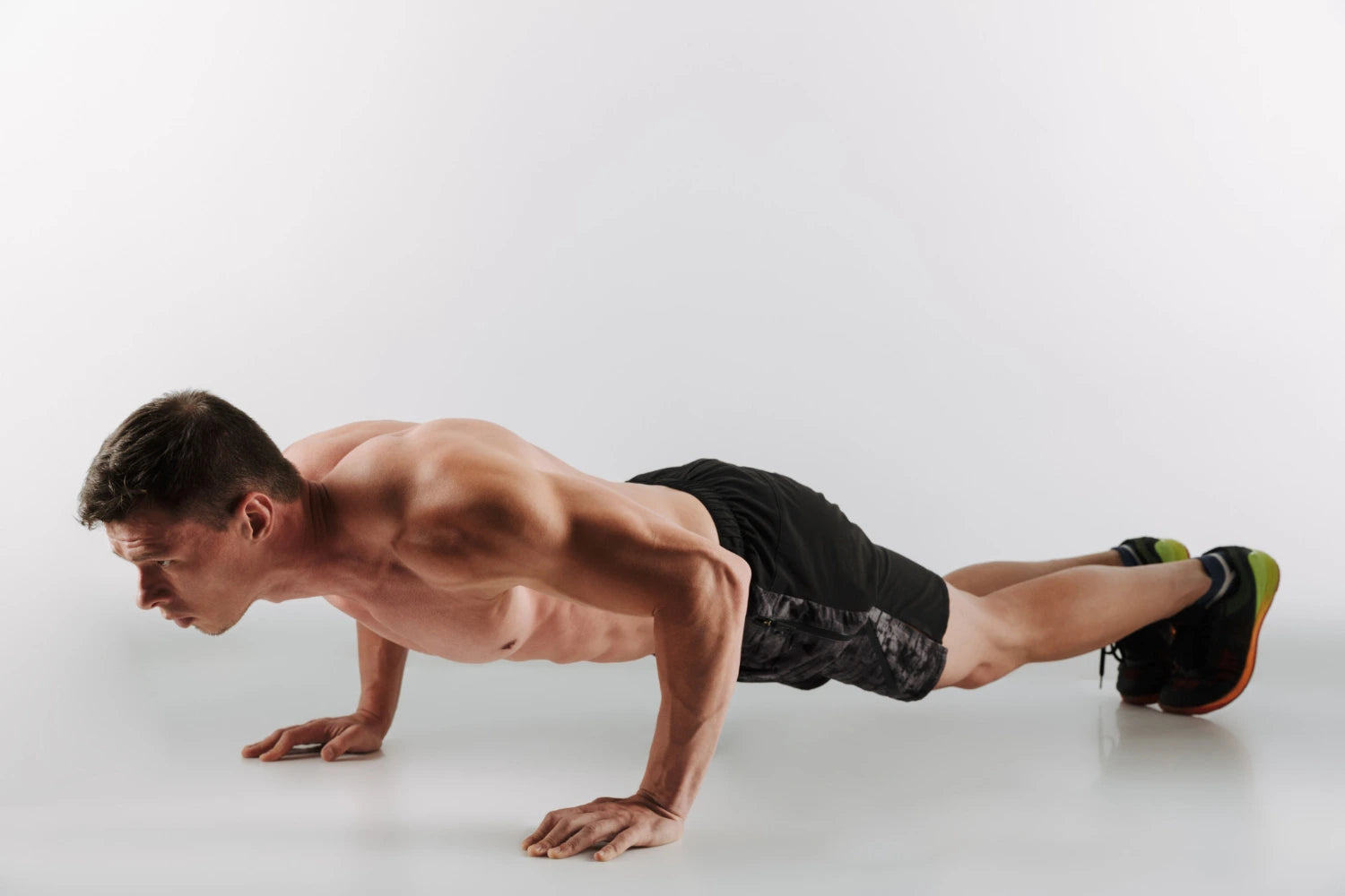 A young man doing a pushup