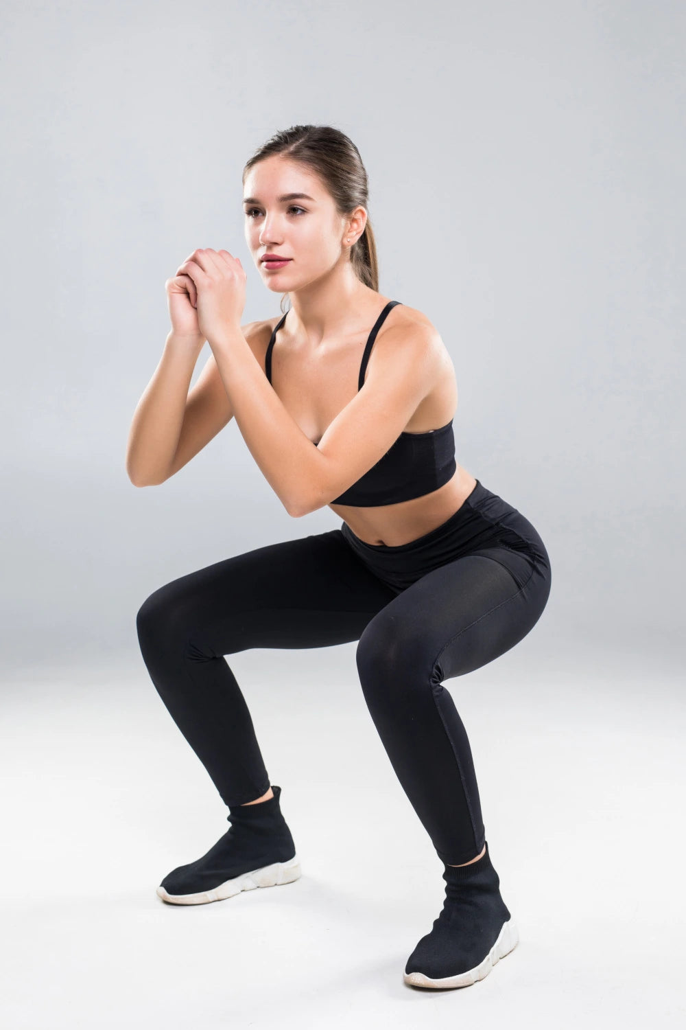 A young woman doing squats