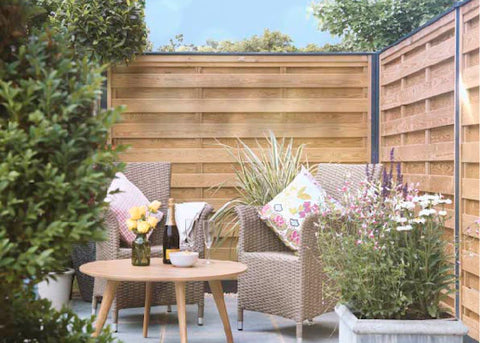 Garden design using metal fence posts and composite fence panels