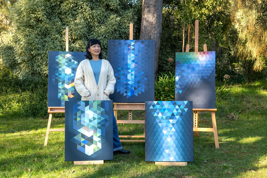 artist Min Ray with her geometric abstract paintings