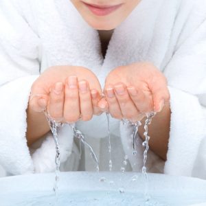 Washing face with clean water