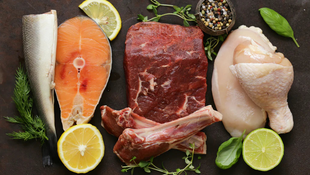 Kitchen counter filled with creatine-rich foods including red meat, poultry, and fish