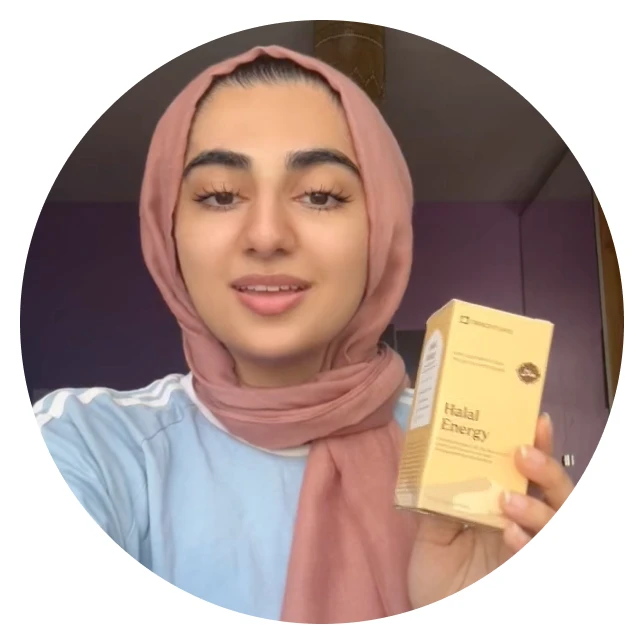 Woman in a hijab holding a box labeled 'Halal Energy.'