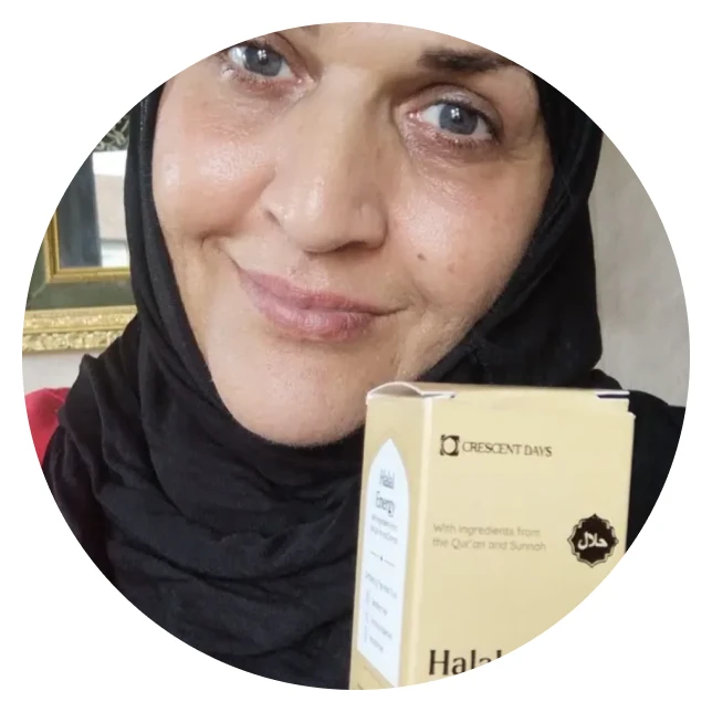 A woman in a black headscarf holding a box of Crescent Days Halal Collagen.