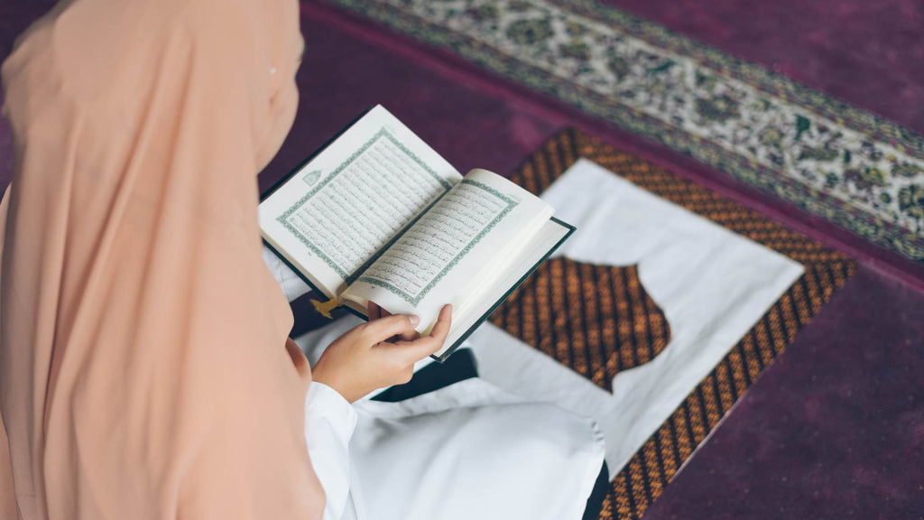 Muslim woman reading Islamic dietary laws from the Quran