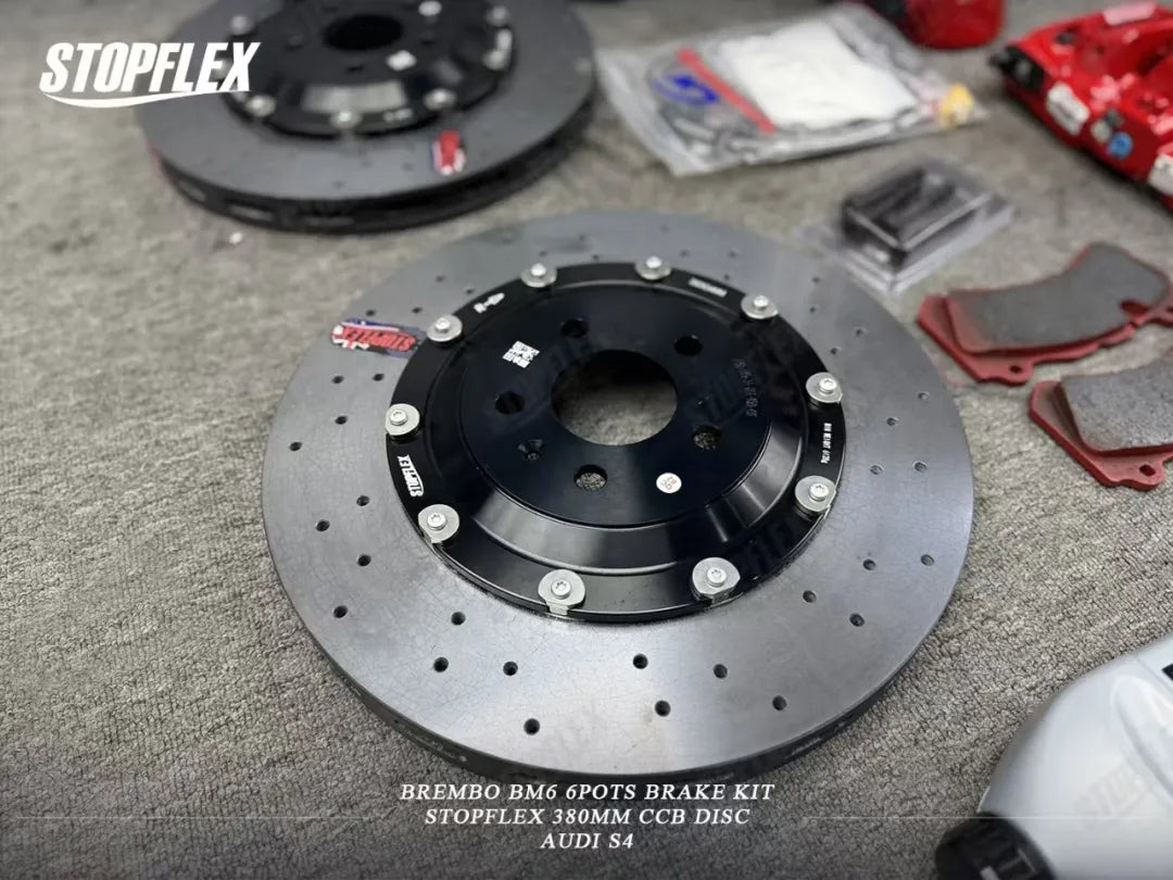 A close-up of the STOPFLEX rotor and factory red Audi S4 brake caliper.