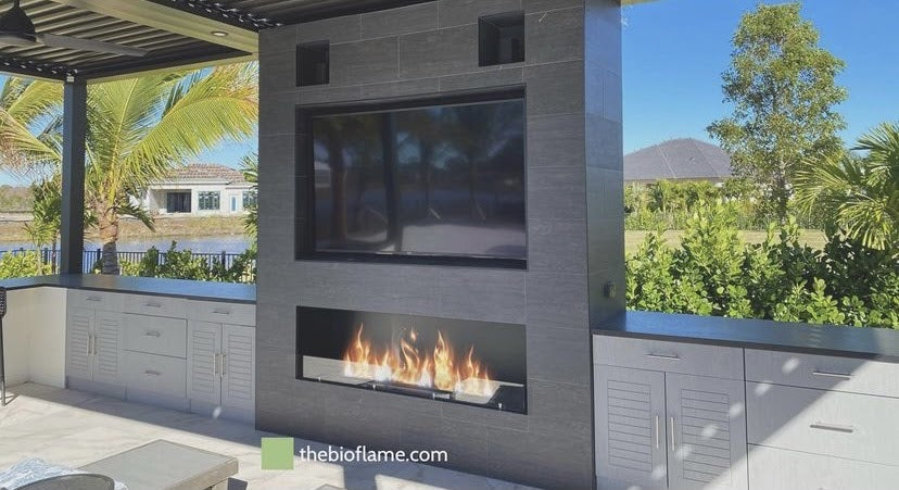 An Ethanol fireplace on a sun room.