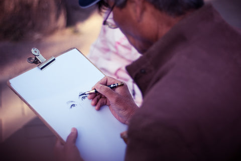 artist drawing faces