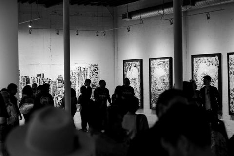 opening reception of art gallery exhibition: consigned artworks sold at auction for gallery commission