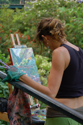 artist works on an en plein air painting from observation