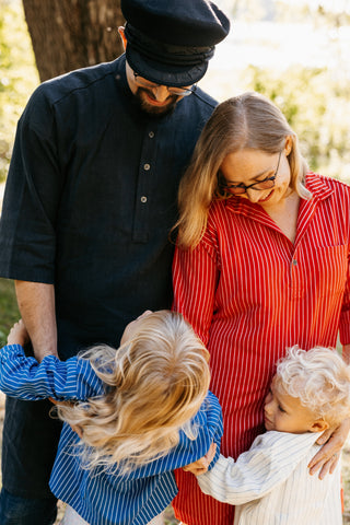 Nordic family. Black linen tunic, Scandinavian red tunic, blue and white children´s shirts