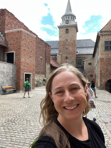 smiling woman at akershus fortress in oslo