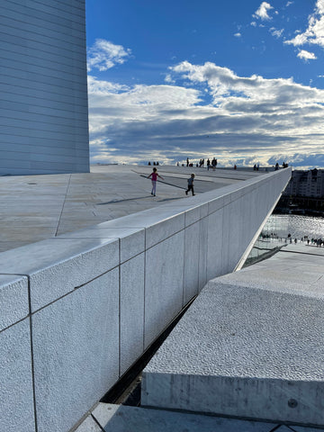 kids running on the Oslo opera house