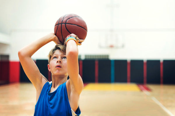 young basketball player shoot