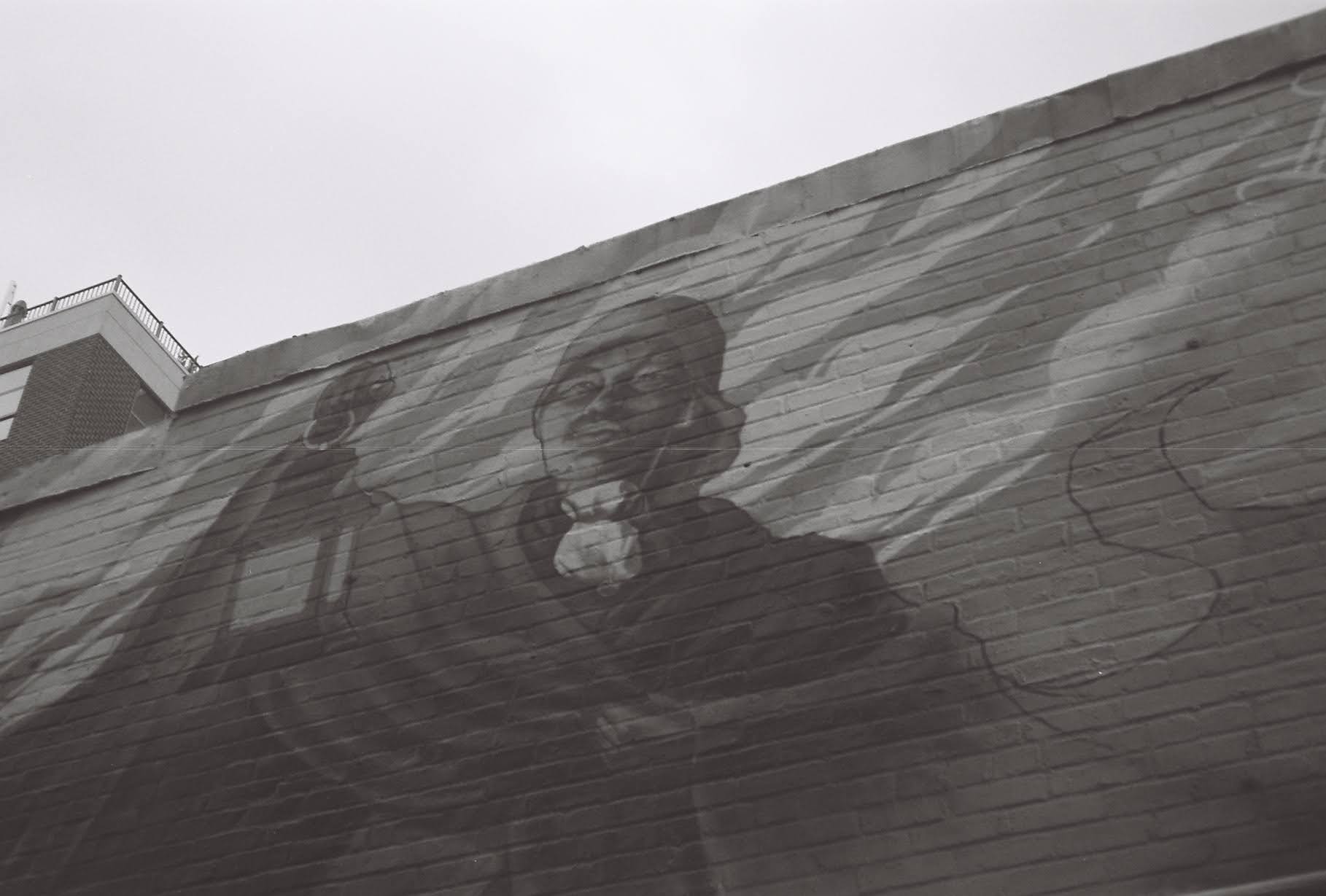 Harriet Tubman painting on the side of a building.