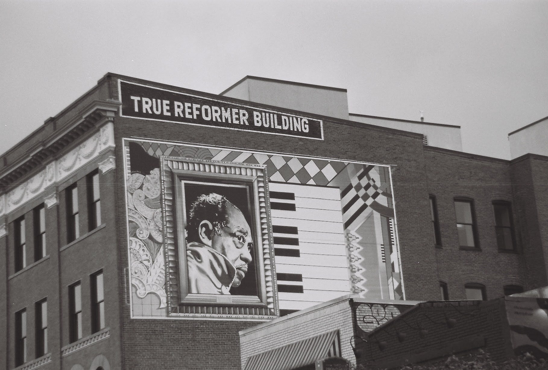 Giant mural of duke Ellington on brick building