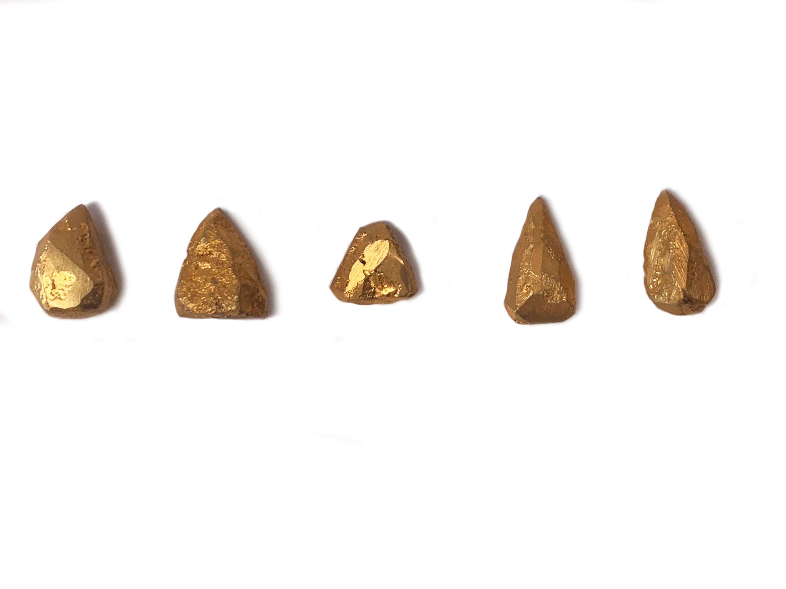 Stone tools, gold plated bronze 