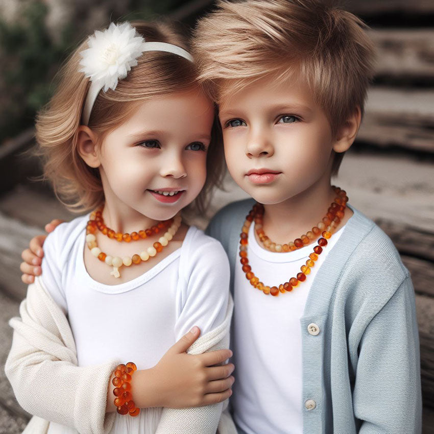 Brother and sister are wearing Baltic amber jewelry (necklace + bracelet)