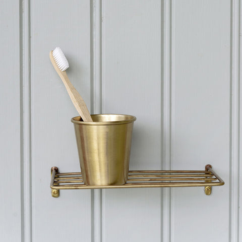 https://cdn.shopify.com/s/files/1/0763/2411/products/brass-shelf-cup_large.jpg?v=1701357893