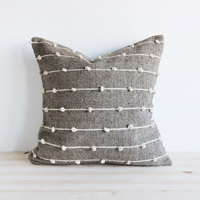 https://cdn.shopify.com/s/files/1/0763/2411/products/wool-throw-pillow-natural-with-white-poms_400x.jpg?v=1571438967