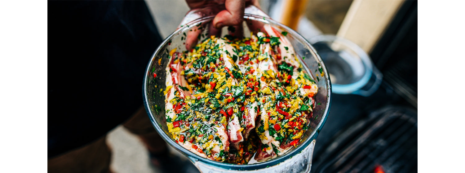 This image shows lamb cutlets with mixed veggies in a bowl