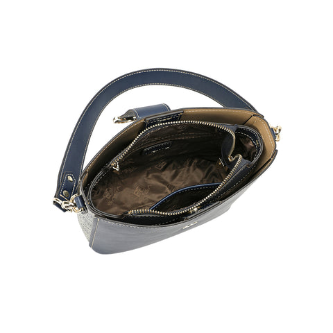 The interior of the Saga leather bag is navy blue with spacious interior pockets