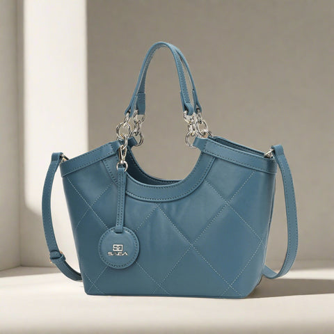 A luxurious women's bag made of luxurious blue leather, branded by Sagai, with triangle stitching on the outside