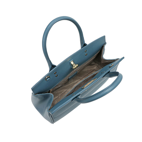 The interior of a light blue women's handbag with interior pockets and interior design details