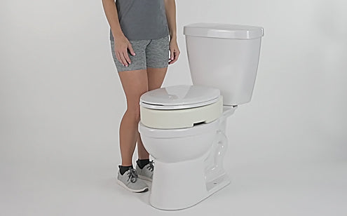 toilet seat riser installed on toilet