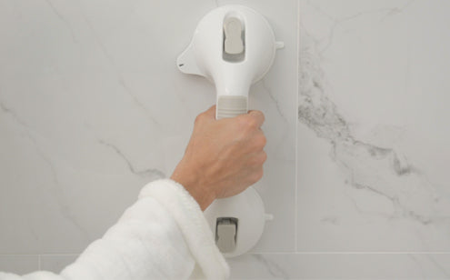 Holding suction grab bar in vertical position