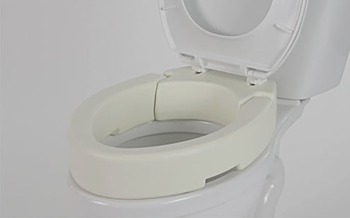 close up image of toilet seat riser attached to toilet