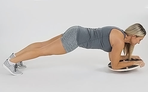 woman planking on wobble board