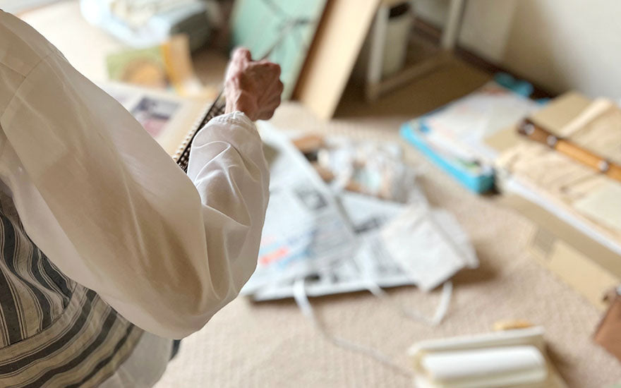 Elderly woman decluttering room